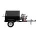 A black towable grill with flip-up side doors and a propane cylinder on it.
