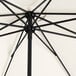 A close up of a black Lancaster Table & Seating umbrella with a white background.