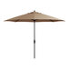 A beige Lancaster Table & Seating umbrella with a black pole.