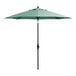 A green umbrella on a black stand.