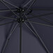 A close up of a black Lancaster Table & Seating round umbrella with a black metal pole.