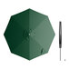 A Lancaster Table & Seating forest green umbrella with a black handle.