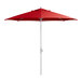 A close up of a red Lancaster Table & Seating umbrella with a silver pole.