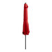 A red umbrella on a black pole.