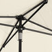 A close up of a white Lancaster Table & Seating square umbrella with a black lift.