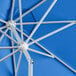 A close up of a cobalt blue Lancaster Table & Seating umbrella.