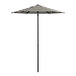 A Lancaster Table & Seating black and white striped umbrella on a stand.