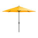 A close up of a yellow Lancaster Table & Seating umbrella with a black stand.