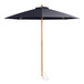 A Lancaster Table & Seating indigo blue bamboo umbrella with a wooden pole and pulley system.