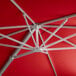 A red umbrella with a silver metal frame and pole.