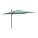 A green Lancaster Table & Seating cantilever umbrella on a metal pole.