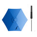 A Lancaster Table & Seating cobalt blue umbrella with a black push lift handle.