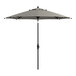 A Lancaster Table & Seating black and white striped umbrella.