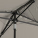 A Lancaster Table & Seating umbrella with a black pole.