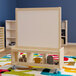 A Flash Furniture wooden mobile double-sided whiteboard on a colorful rug.