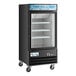 An Avantco black swing glass door freezer on wheels.