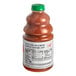 A close-up of a Dr. Smoothie bottle of guava passion fruit smoothie mix with a green cap.