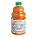 A close up of a bottle of Dr. Smoothie 100% Crushed Tropical Sunshine fruit smoothie mix with a green cap.
