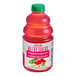 A bottle of Dr. Smoothie Watermelon Cucumber Mint Refresher concentrate with red liquid inside.