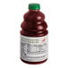 A bottle of Dr. Smoothie Organic Strawberry Fruit Smoothie Mix with a green cap on a counter.