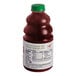 A bottle of Dr. Smoothie Organic Raspberry Fruit Smoothie Mix with a green cap.