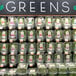 A wall of glass containers of greens with Retail Space Solutions SpaceGrid DoubleSpace Produce Pushers.