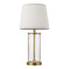 A Globe glass table lamp with a gold base and white shade.