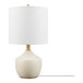 A white ceramic table lamp with brass accents and a white shade.