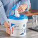 A blue bucket of WypAll CriticalClean wet wipes.