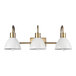 A Globe 3-light vanity light fixture with white dome shades.