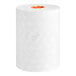 A roll of white Scott Pro hard roll paper towel.