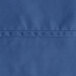 A close up of a royal blue fabric with a white hem.