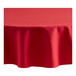 An Oxford red round tablecloth on a table.