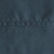A close up of navy blue 100% spun polyester fabric with stitching.