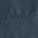 A close up of a navy blue hemmed fabric square.