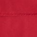 A close up of a red Oxford cloth table cover.