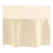 An ivory Oxford round tablecloth on a table.