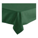 A Hunter Green Oxford square tablecloth with a folded edge on a table.