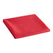 A red folded cloth on a white background.