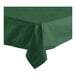 A folded edge hunter green rectangular tablecloth on a table.