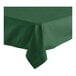 A hunter green hemmed Oxford square tablecloth on a table.