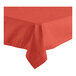 A red Oxford 64" x 64" square tablecloth with a folded edge on a white table.