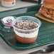 A plastic tray with 8 Our Specialty Treat Shop Chocolate Mousse Parfait Cups with white and brown topping.