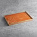 A large rectangular brown Rich's Allen Un-Iced Yellow Cake sheet wrapped in plastic.