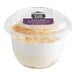 A plastic Our Specialty Treat Shop French-Style Cheesecake Mousse Parfait cup with a dessert inside.