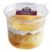 A white Our Specialty Treat Shop Traditional Tres Leches Cake cup with a label.
