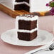 A slice of Rich's Allen un-iced chocolate cake on a plate with a fork.