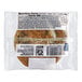 An individually wrapped Our Specialty Treat Shop chocolate chip cookie in a plastic bag with a label.