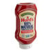 A plastic squeeze bottle of Hunt's tomato ketchup with a white label.