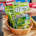 A basket filled with bags of BIGS Vlasic Dill Pickle Flavored Sunflower Seeds.